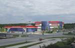 Торговый комплекс в р.п. Кольцово на пересечении Никольского проспекта и проспекта Академика Сандахчиева.